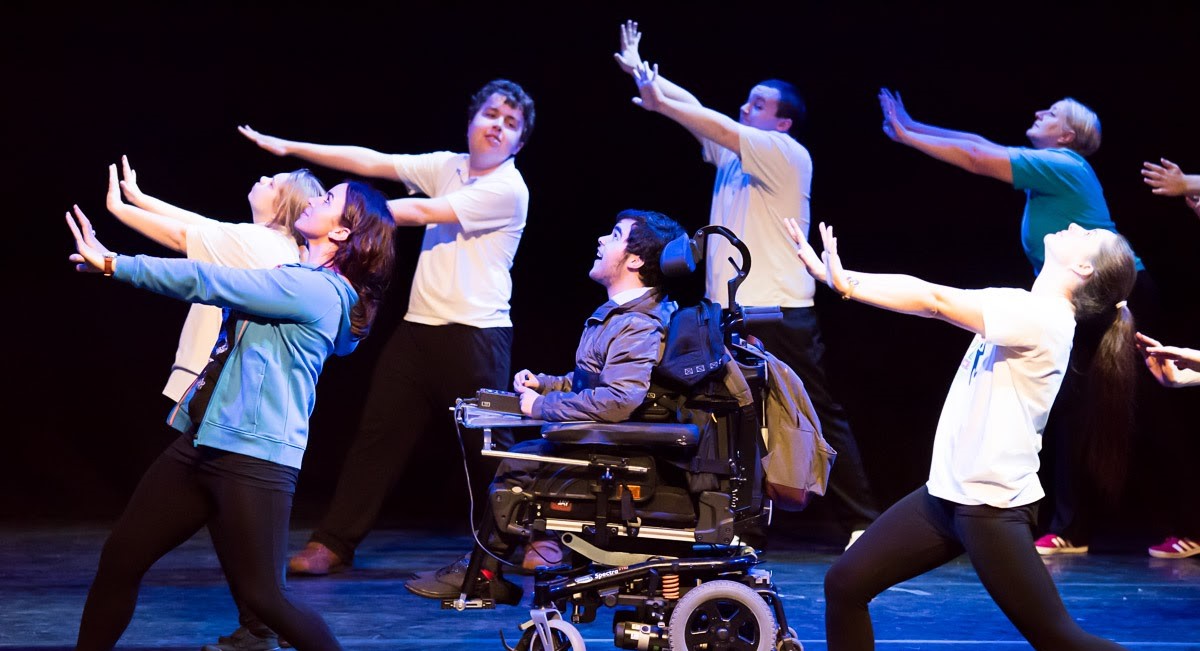 A group of disabled and non-disabled Rubicon dancers performing on stage