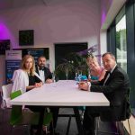 Four people sitting around a table